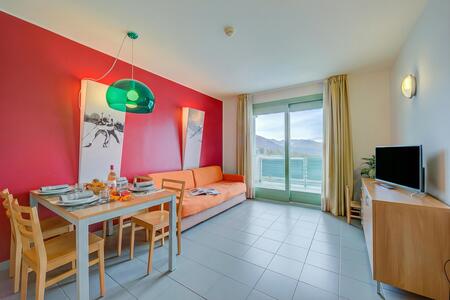 Living area with sofa bed and balcony view